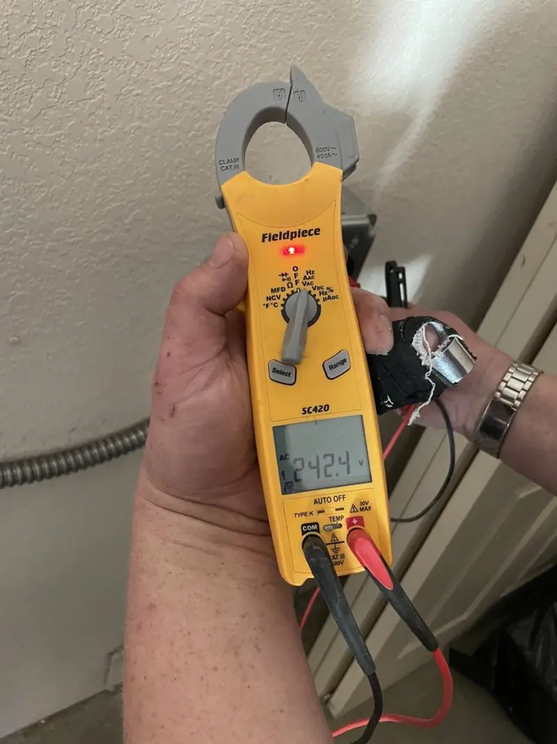 Voltage testing with clamp meter during Generator Installation in Statesboro